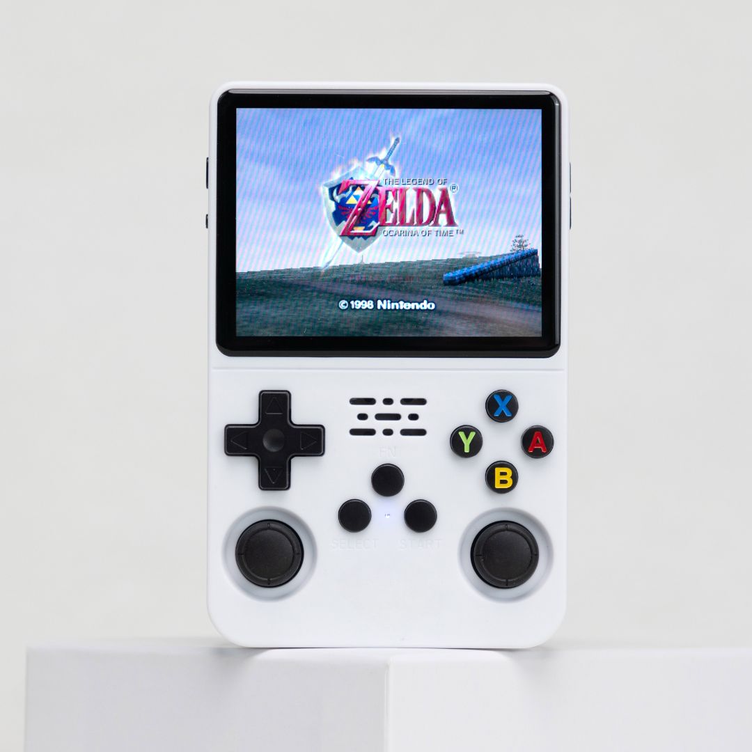 Handheld gaming console with screen displaying 'The Legend of Zelda' on a white background